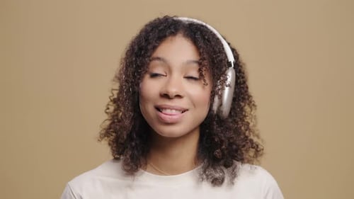 Woman Listening to Music with Wireless Headphones