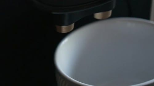 Close Up of Espresso Machine Filling Mug