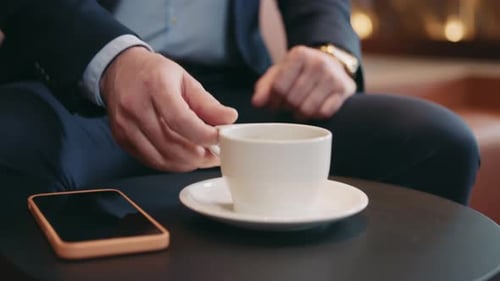 Man with Gray Hair Drinking Coffee Close Up