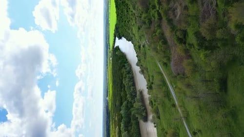 Vertical Video Landscape of Nature Concept Aerial View of the River Quadcopter Flying Over a Green