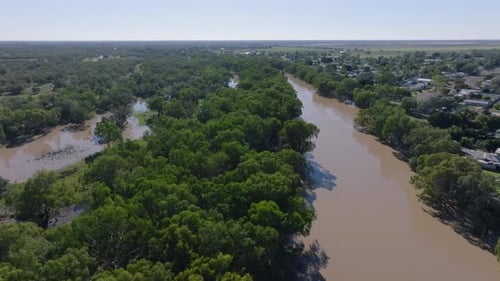 Aerial: Drone shot of a full Darling River that has burst it's banks at Bourke, Outback NSW, Austral