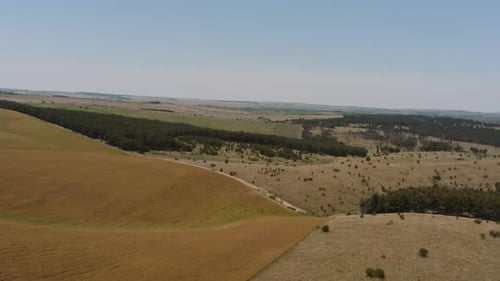 Aerial View of Rolling Hills and Green Meadows