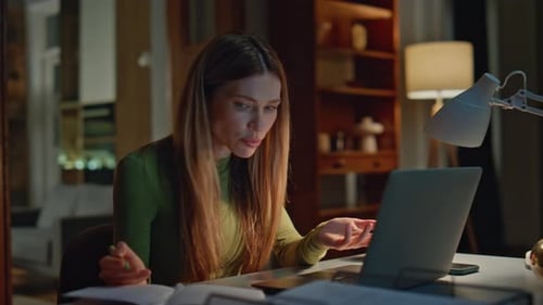 Woman Working Late at Home on Laptop