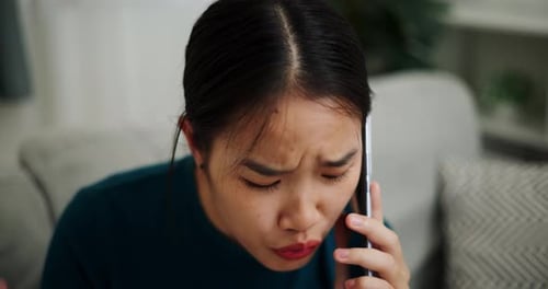 Young Woman Talking on Phone Indoors