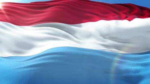 Luxembourg Flag Waving in Bright Sunlight