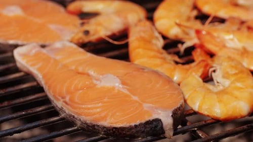Chef Cooking Shrimps with Oil and Spices on Grill Closeup Prawns on Fire Throwing Them on Pan Dorado