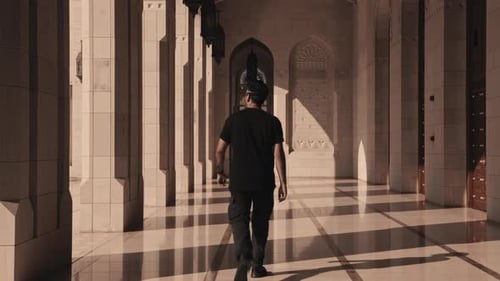 Man Exploring Sultan Qaboos Grand Mosque in Oman – Cinematic Travel Footage