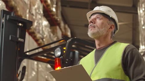 Adult Foreman Inspecting Warehouse