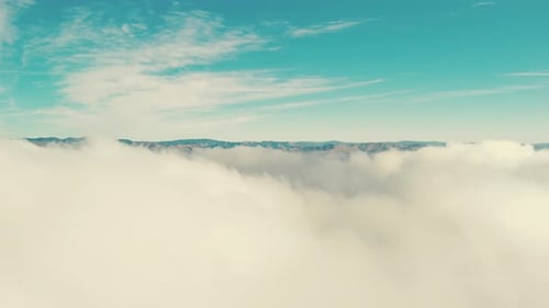 Aerial View Footage of Flies Through White Fluffy Clouds