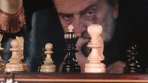 Man Plays Chess Game, Close Up