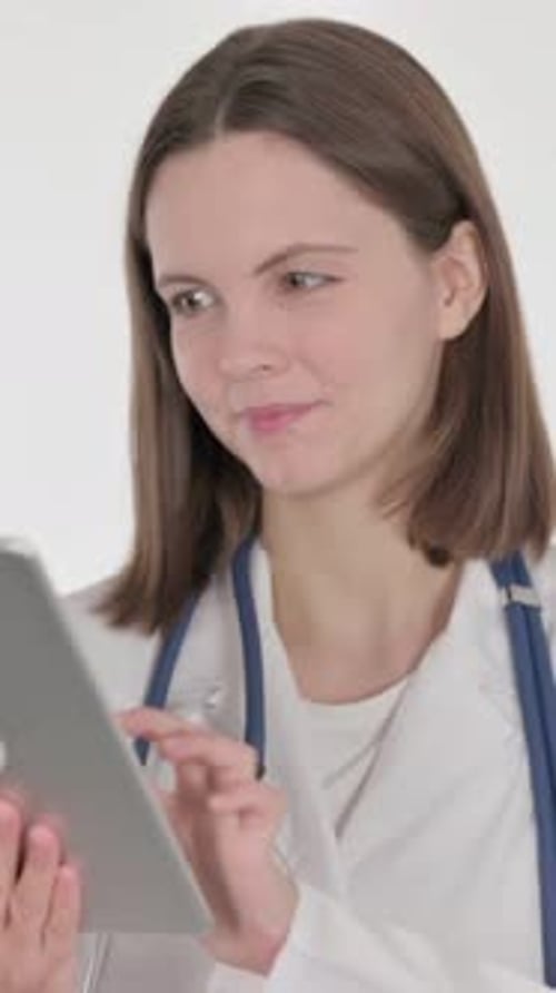 Young Woman Doctor Using Digital Tablet Device