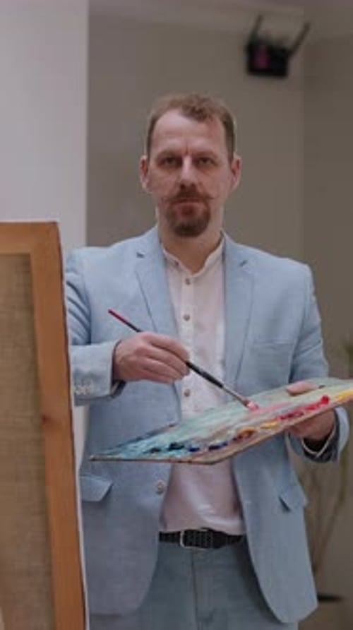 Beaded Artist Contemplates Model in Studio