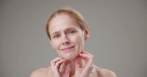 Woman Posing With Hands on Her Face