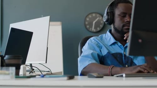 Two Gen Z Men Working in Office