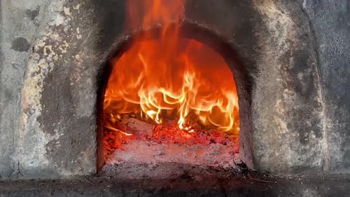 Burning Fire Inside Brick Fire Pit