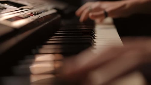 Close Up of Hands Playing Keyboard