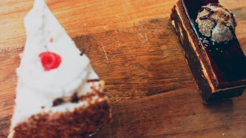 Assorted Delicious Cakes Presented on Wooden Table