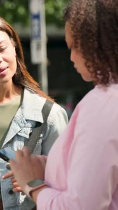 Vertical video: Tapping phone, pink-shirt showing phone at curb, denim jacket leaving to continue