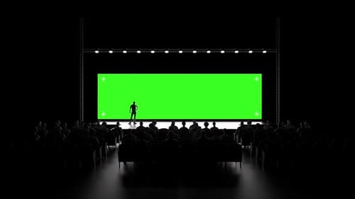 Conference Stage with Large Green Screen Display and Audience
