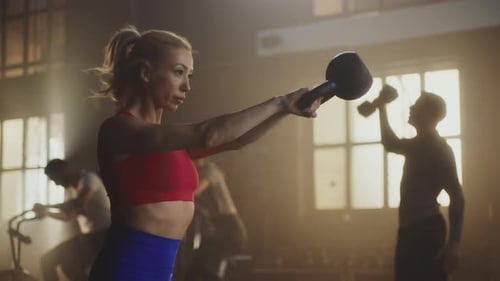 Woman doing kettlebell swing exercise