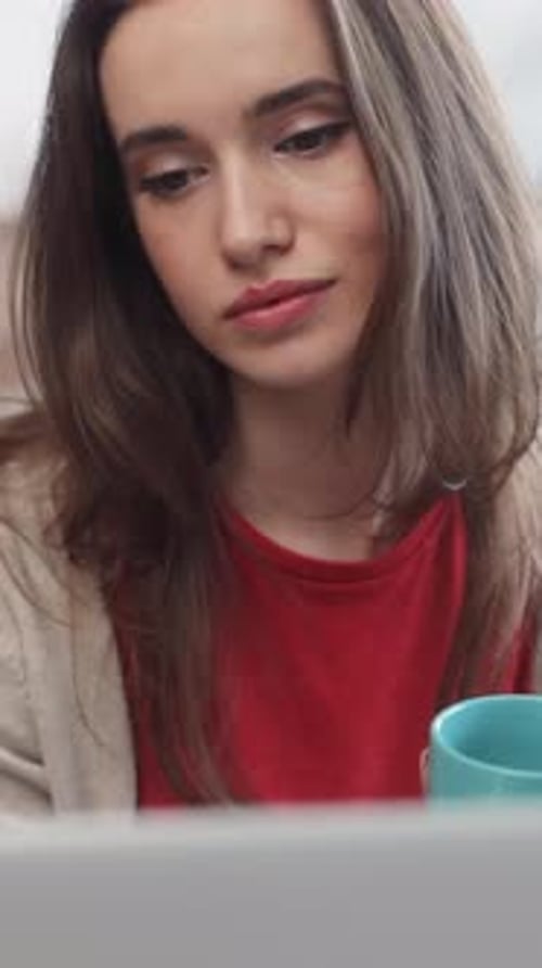 Woman Works at Home with Coffee