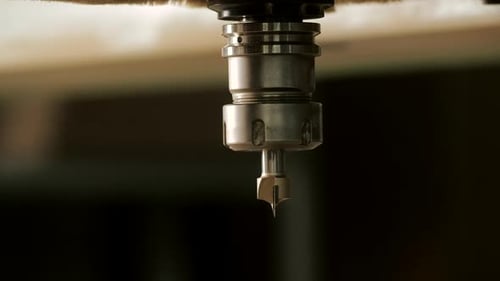 Router Bit Mounted on Machine in Workplace