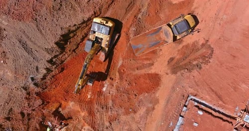 Aerial View of Excavator and Dump Truck