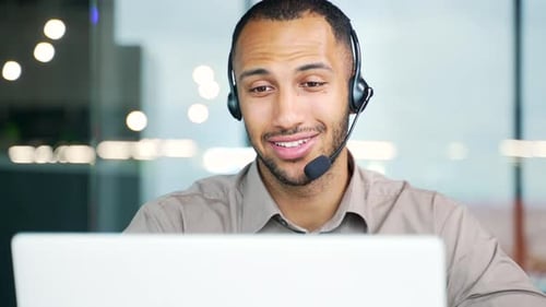 Customer service and telemarketing male agent in office doing computer consultation with headset.