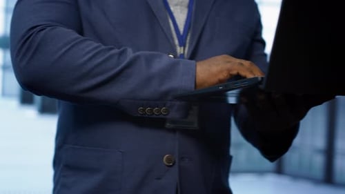 Close Up of IT Professional in Data Center Fixing Errors