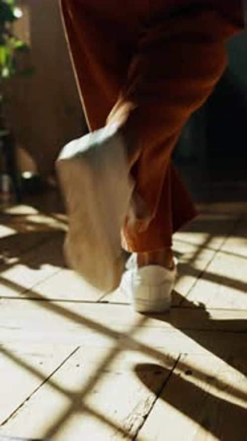 Walking, house and person with shoes, fashion or sneakers on wooden floor for back view