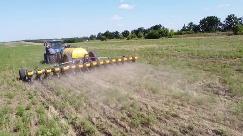 Blue Tractor O.A. Planting Canola On No Till Field