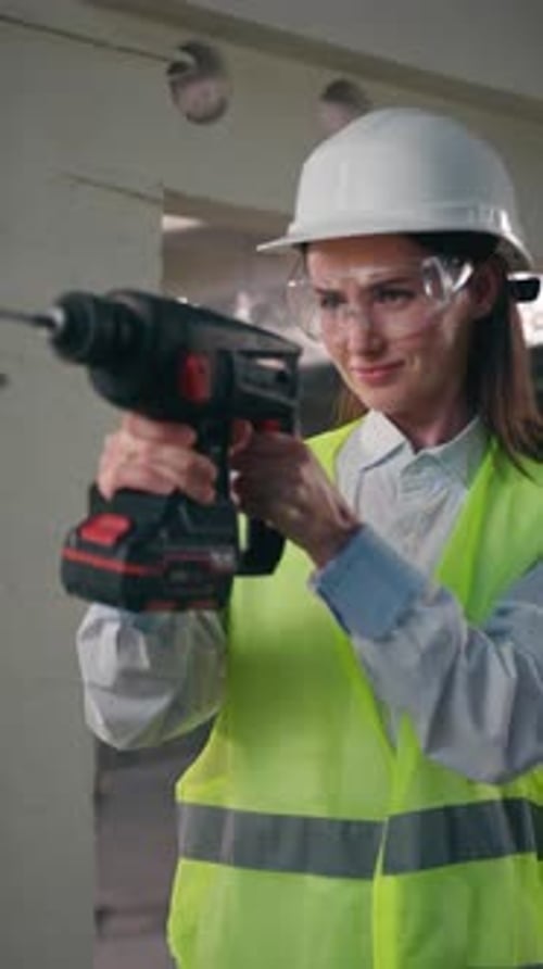 Confident Professional Caucasian Woman Holding Electric Drill Drilling Using Equipment Female Girl