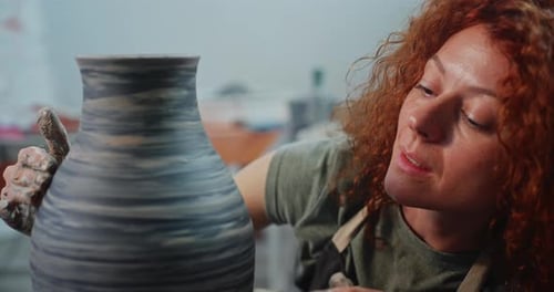 Woman Making Pottery Vase on Wheel Close Up