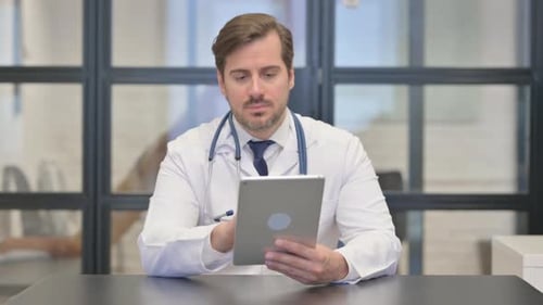 Doctor Using Digital Tablet in Hospital