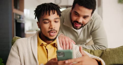 Happy, phone and young gay couple networking on social media, mobile app