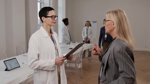 Medical Professionals Meeting in Conference Room at Hospital