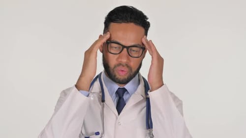 Doctor Rubbing Temples Showing Headache