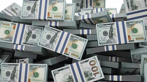 Falling Bundles of US Dollars Accumulating on White Background