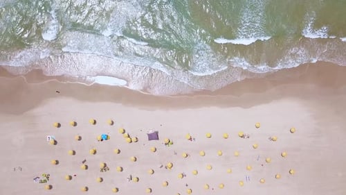 Summertime in a public Beach with colorful umbrellas