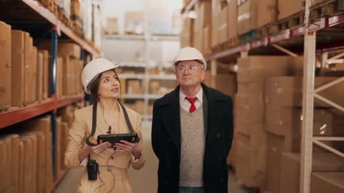 Warehouse Workers Inspect Inventory, Pointing and Walking