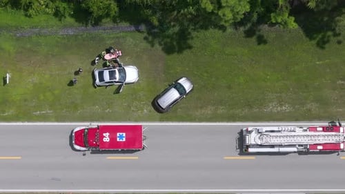 Aerial View of Car Accident Scene with First Responders