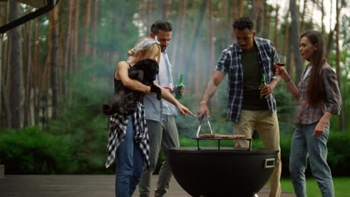 Closeup Cheerful Friends Spending Time in Forest Near Bbq Grill. Friendly People