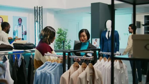 Young People Talking About Fashion Collection in Store