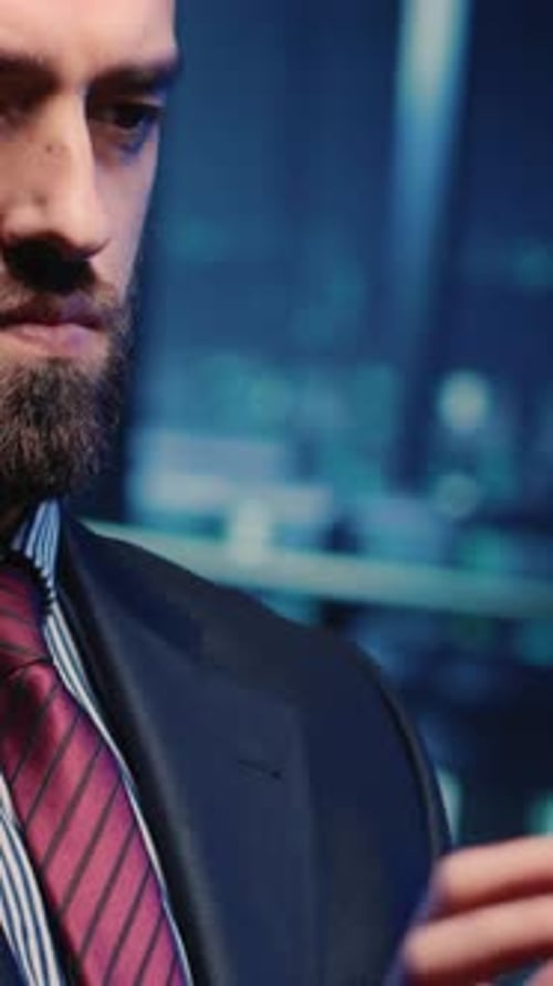 Close Up on Man Using Phone in City Night