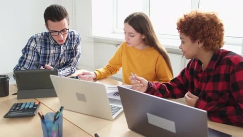 Team of Young Adults Collaborating on a Project