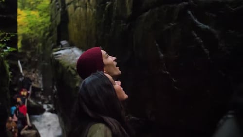 Couple Hiking Through Franconia Notch Forest