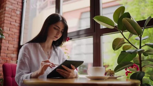 Woman With Tablet And Stylus In Cafe Busy Businesswoman Working Remotely In Dinner Time
