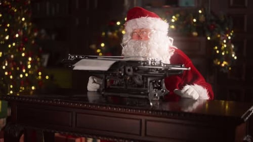 Santa Typing on Typewriter with Christmas Background