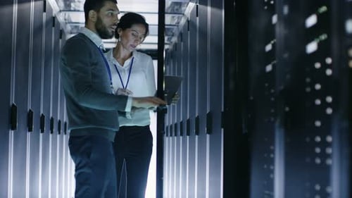 IT Team Working at Data Center Server Room