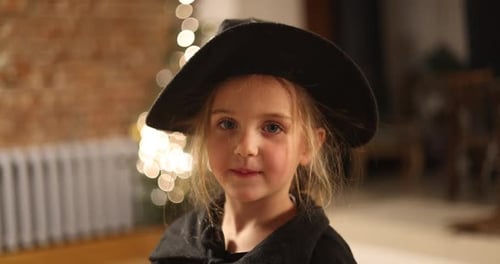 Charming Young Girl Dressed in Beautiful Historical Attire Complete with Stylish Black Hat Life